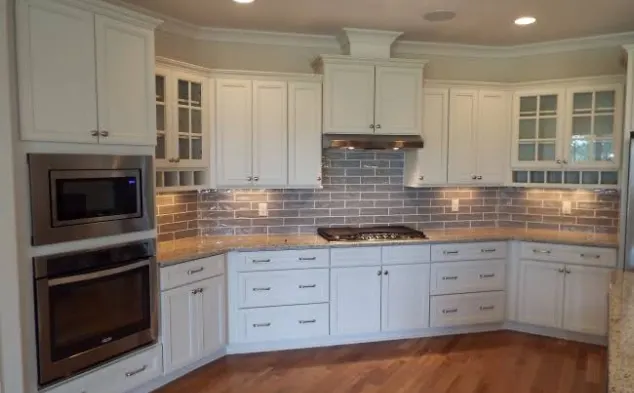 Kitchen with glass subway tile backsplash